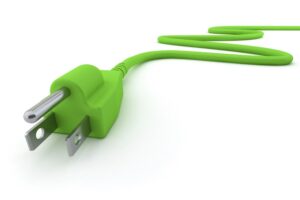 Green Electric Plug. Digitally Generated Image isolated on white background